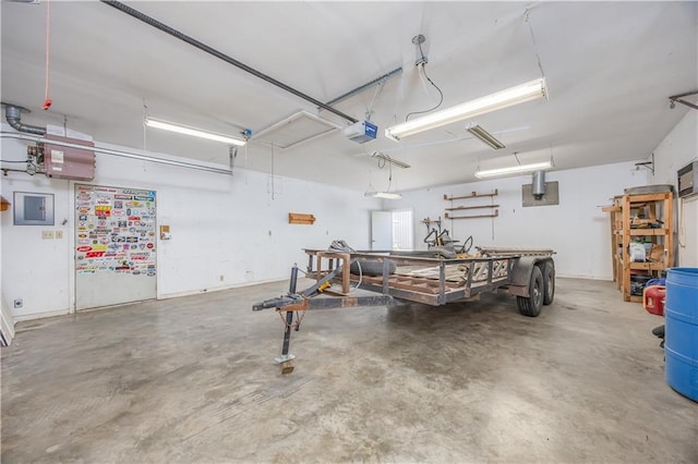 3931 Main St, Parsons, KS 67357 - garage with a garage door opener and a workshop area