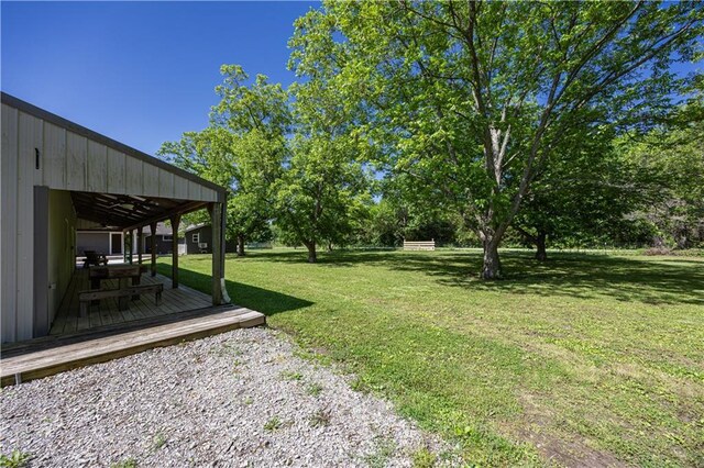 3931 Main St, Parsons, KS 67357 - view of green lawn featuring a wooden deck