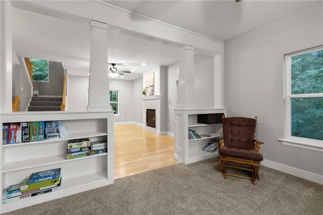 13807 W 47th Ter, Shawnee, KS 66216 - sitting room with a ceiling fan, a warm lit fireplace, carpet floors, and baseboards