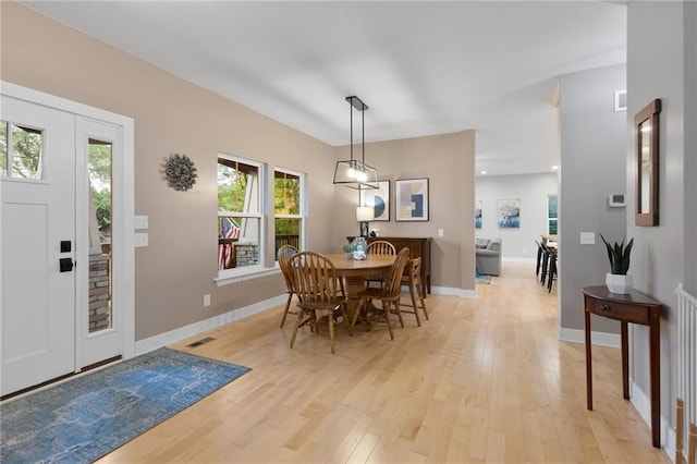 13807 W 47th Ter, Shawnee, KS 66216 - dining space with light wood-style flooring and baseboards