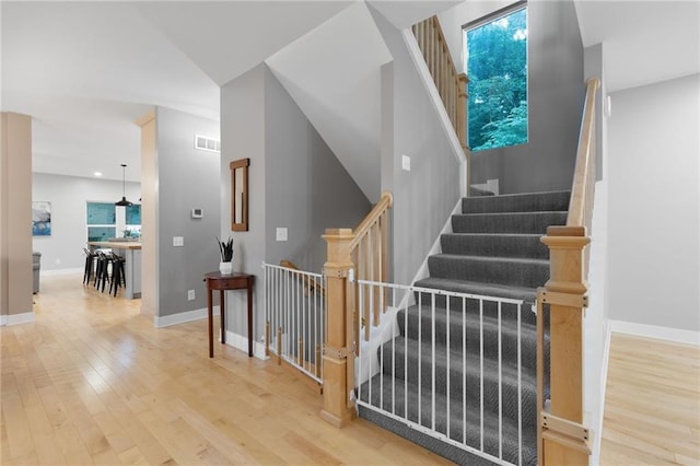 13807 W 47th Ter, Shawnee, KS 66216 - stairway with wood finished floors, baseboards, and recessed lighting