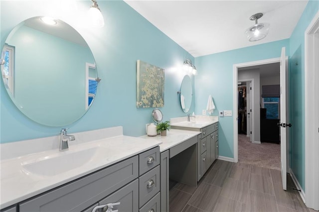 13807 W 47th Ter, Shawnee, KS 66216 - bathroom with vanity, baseboards, and a walk in closet