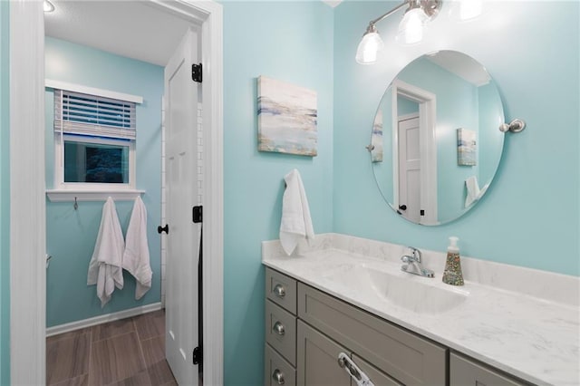 13807 W 47th Ter, Shawnee, KS 66216 - bathroom with vanity, baseboards, and a closet
