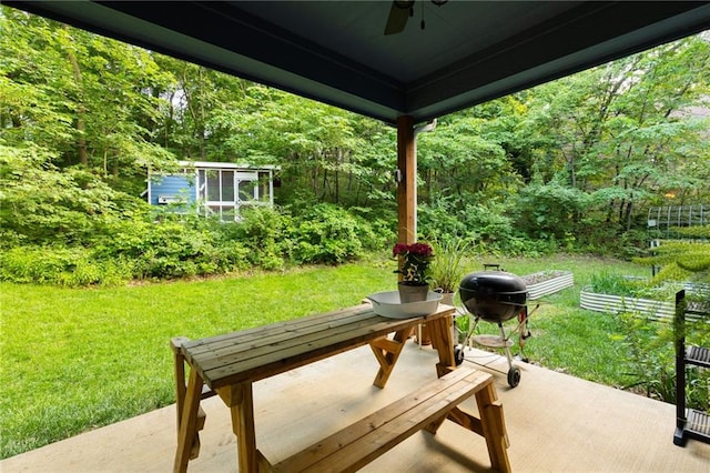 13807 W 47th Ter, Shawnee, KS 66216 - view of patio / terrace with a ceiling fan and a view of trees