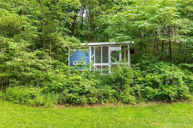 13807 W 47th Ter, Shawnee, KS 66216 - view of outbuilding with a forest view