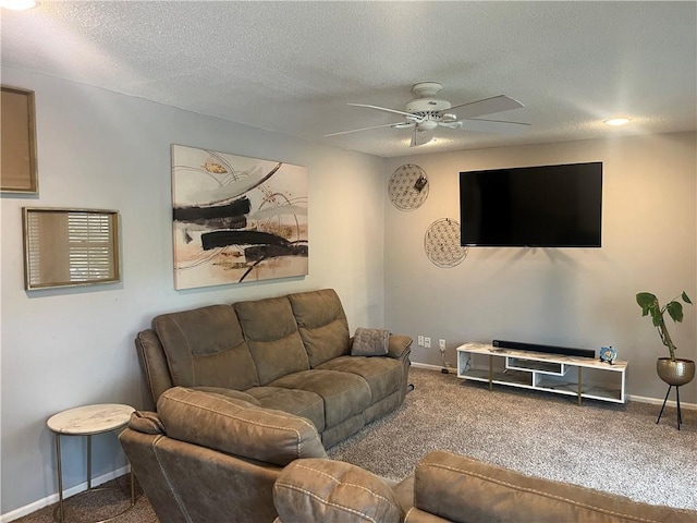 8425 N Tracy Ave, Kansas City, MO 64155 - living room featuring carpet flooring, ceiling fan, baseboards, and a textured ceiling