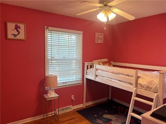 8425 N Tracy Ave, Kansas City, MO 64155 - bedroom with wood finished floors and baseboards