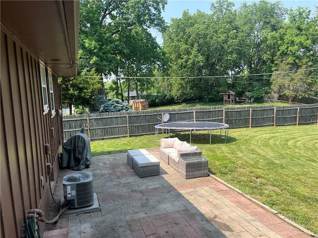 8425 N Tracy Ave, Kansas City, MO 64155 - view of patio / terrace featuring a trampoline, cooling unit, and grilling area