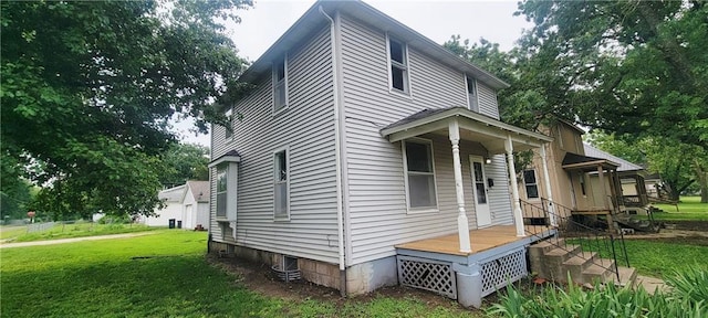 403 S St, Iola, KS 66749 - view of home's exterior with a yard