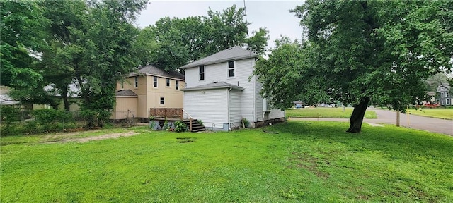 403 S St, Iola, KS 66749 - back of house with a lawn
