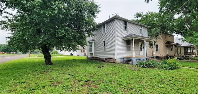 403 S St, Iola, KS 66749 - view of side of home featuring a lawn