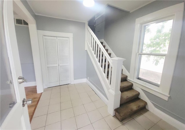 403 S St, Iola, KS 66749 - staircase with baseboards and tile patterned floors