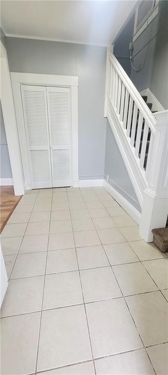 403 S St, Iola, KS 66749 - interior space with tile patterned floors and baseboards