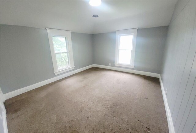 403 S St, Iola, KS 66749 - unfurnished room with baseboards and carpet flooring