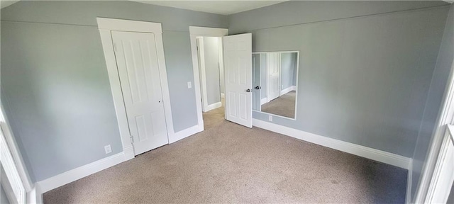 403 S St, Iola, KS 66749 - unfurnished bedroom featuring carpet flooring and baseboards