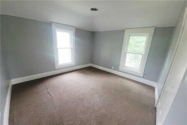 403 S St, Iola, KS 66749 - carpeted empty room with baseboards