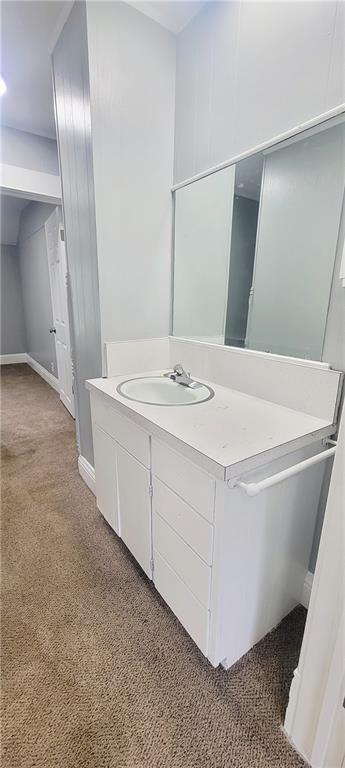 403 S St, Iola, KS 66749 - bathroom with vanity and baseboards