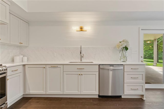 1810 S 98th St, Edwardsville, KS 66111 - kitchen featuring stainless steel appliances, tasteful backsplash, light countertops, and white cabinets