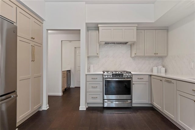 1810 S 98th St, Edwardsville, KS 66111 - kitchen featuring appliances with stainless steel finishes, dark wood-style flooring, decorative backsplash, and custom range hood