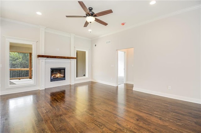 22900 S Ridgeview Dr, Peculiar, MO 64078 - unfurnished living room with a ceiling fan, wood finished floors, a glass covered fireplace, crown molding, and recessed lighting