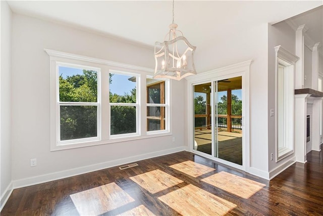 22900 S Ridgeview Dr, Peculiar, MO 64078 - unfurnished dining area featuring healthy amount of natural light, a chandelier, and dark wood-style floors