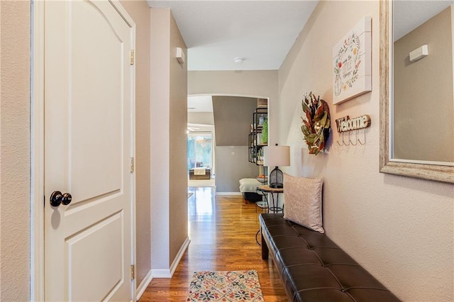 3222 SW Shadow Brook Dr, Blue Springs, MO 64015 - hallway featuring wood finished floors and arched walkways