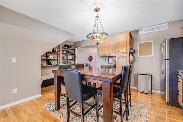 3222 SW Shadow Brook Dr, Blue Springs, MO 64015 - dining room featuring light wood-style floors and arched walkways