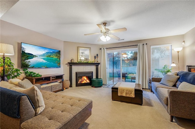 3222 SW Shadow Brook Dr, Blue Springs, MO 64015 - living area with carpet flooring, healthy amount of natural light, ceiling fan, and a tiled fireplace