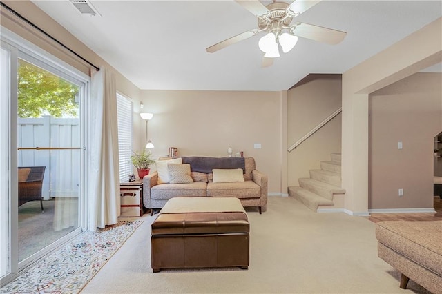 3222 SW Shadow Brook Dr, Blue Springs, MO 64015 - living area with stairway, carpet, and ceiling fan