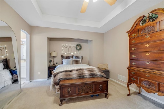 3222 SW Shadow Brook Dr, Blue Springs, MO 64015 - bedroom featuring a raised ceiling, light carpet, arched walkways, and ceiling fan