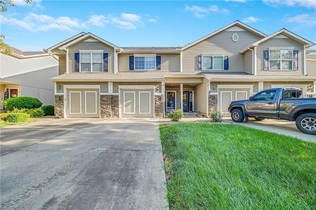 3222 SW Shadow Brook Dr, Blue Springs, MO 64015 - view of front facade with stone siding, concrete driveway, and a front yard