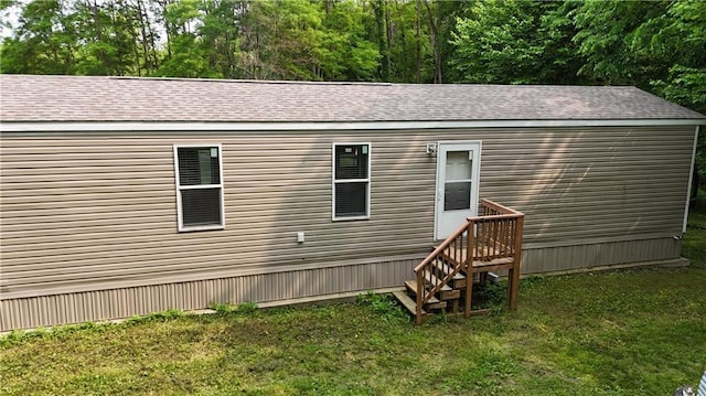 17922 County Road 361, Savannah, MO 64485 - rear view of house with a lawn and roof with shingles