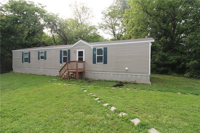 17922 County Road 361, Savannah, MO 64485 - manufactured / mobile home with a front lawn and view of wooded area