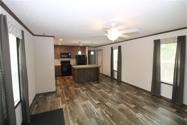 17922 County Road 361, Savannah, MO 64485 - kitchen featuring black appliances, a kitchen island, crown molding, a ceiling fan, and dark wood-type flooring