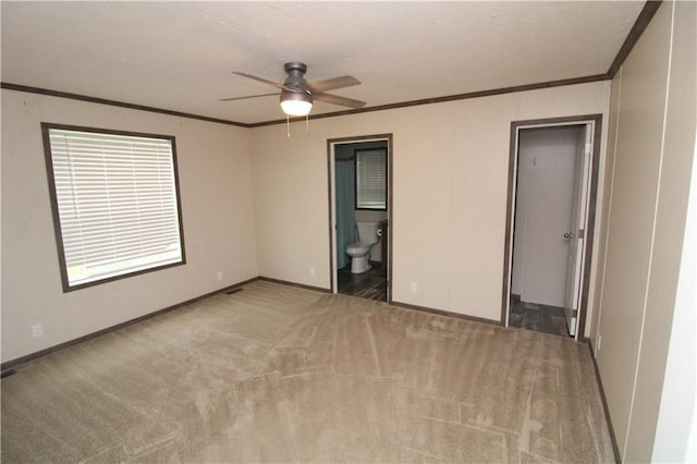 17922 County Road 361, Savannah, MO 64485 - unfurnished room featuring a ceiling fan, crown molding, carpet, and baseboards