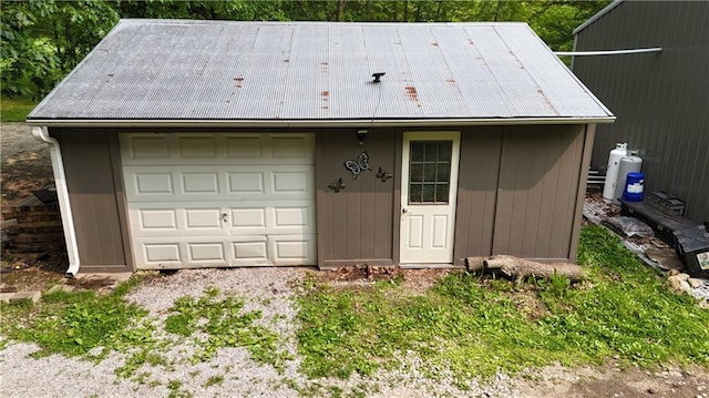 17922 County Road 361, Savannah, MO 64485 - view of front facade featuring an outdoor structure, a detached garage, and metal roof