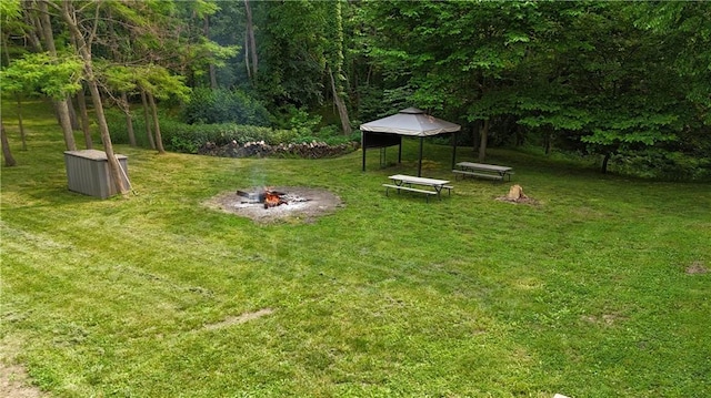 17922 County Road 361, Savannah, MO 64485 - view of grassy yard with an outdoor fire pit