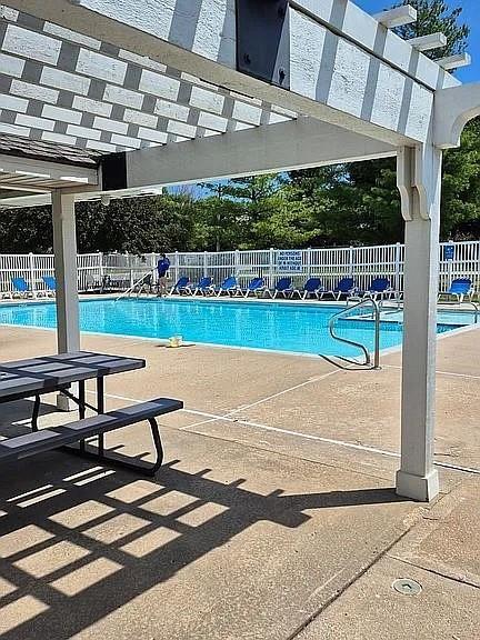1404 SE Lexington Ave, Lees Summit, MO 64081 - community pool with a pergola and a patio