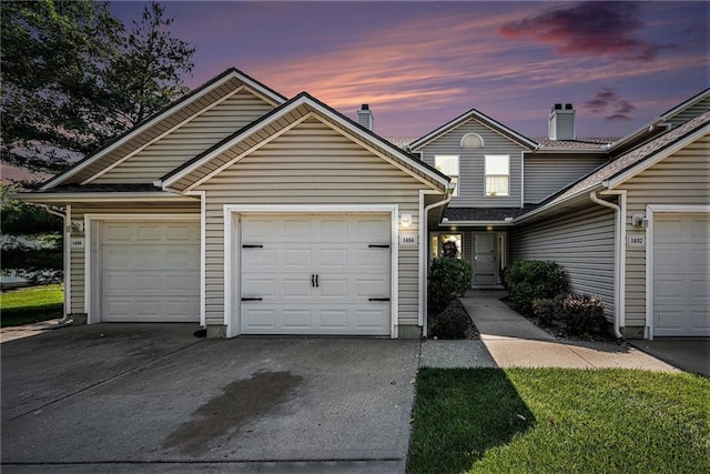 1404 SE Lexington Ave, Lees Summit, MO 64081 - traditional home with concrete driveway and a garage