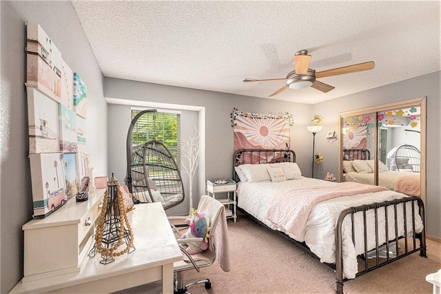 1404 SE Lexington Ave, Lees Summit, MO 64081 - bedroom with carpet, a ceiling fan, a textured ceiling, and access to exterior