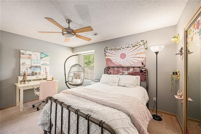 1404 SE Lexington Ave, Lees Summit, MO 64081 - carpeted bedroom featuring baseboards, a closet, a ceiling fan, and a textured ceiling