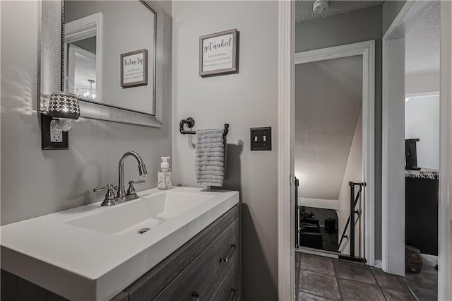 11702 E 246th St, Peculiar, MO 64078 - bathroom with vanity and a textured ceiling