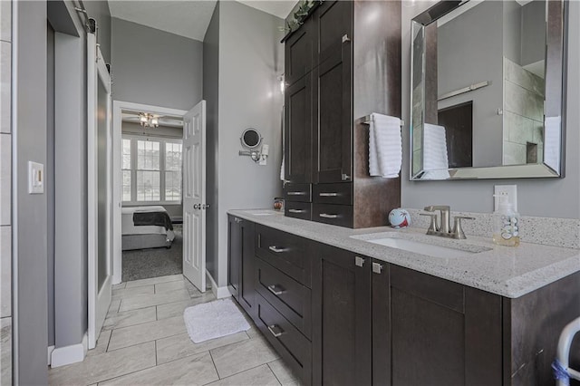 11702 E 246th St, Peculiar, MO 64078 - ensuite bathroom featuring double vanity and baseboards
