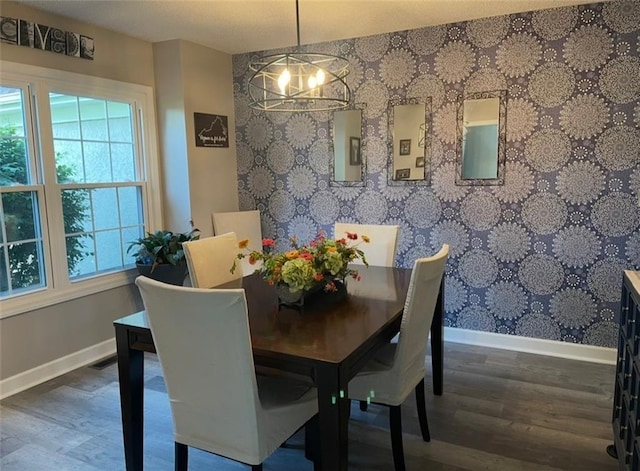 11702 E 246th St, Peculiar, MO 64078 - dining room featuring wood finished floors, a chandelier, and wallpapered walls