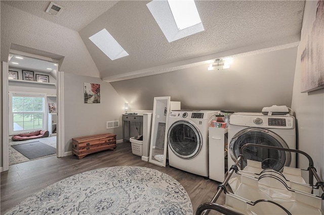 11702 E 246th St, Peculiar, MO 64078 - washroom with a skylight, independent washer and dryer, a textured ceiling, and wood finished floors