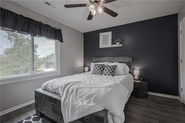 11702 E 246th St, Peculiar, MO 64078 - bedroom featuring wood finished floors, a textured ceiling, and a ceiling fan