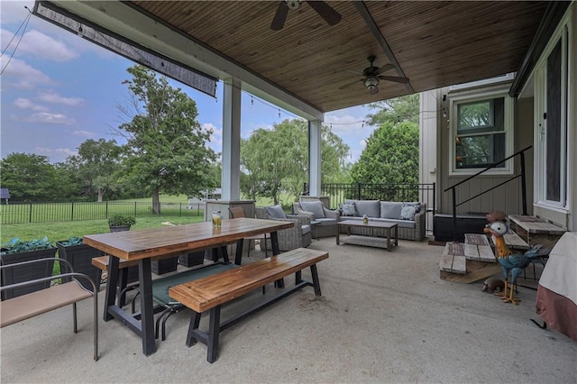 11702 E 246th St, Peculiar, MO 64078 - fenced backyard with outdoor lounge area, a patio area, ceiling fan, and outdoor dining space