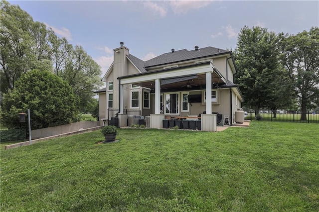 11702 E 246th St, Peculiar, MO 64078 - rear view of house featuring outdoor lounge area, a chimney, a fenced backyard, a patio, and a ceiling fan