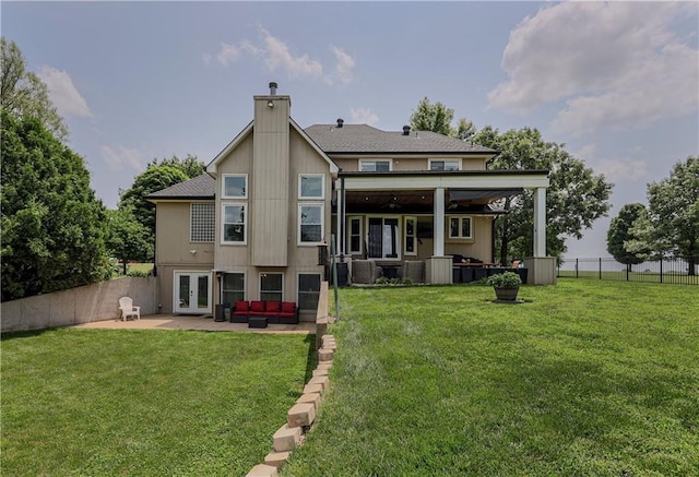 11702 E 246th St, Peculiar, MO 64078 - back of house with an outdoor hangout area, french doors, a patio, a chimney, and ceiling fan