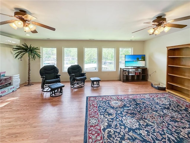 15157 Bass Cove Rd, Gravois Mills, MO 65037 - living area with ceiling fan, plenty of natural light, a wall mounted air conditioner, wood finished floors, and recessed lighting